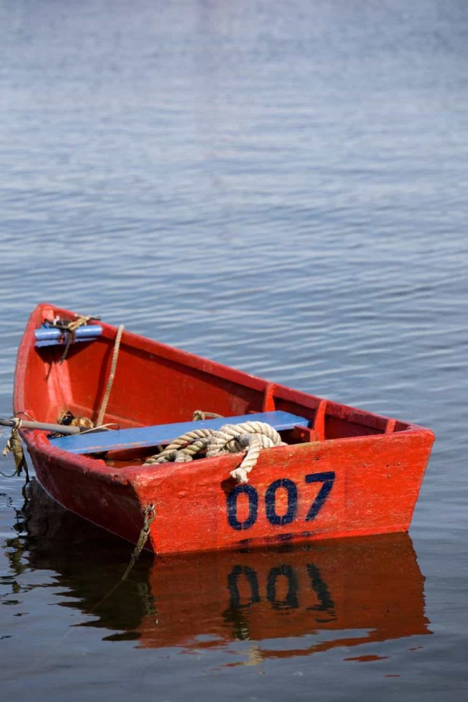 A lone dingy sits in the harbor