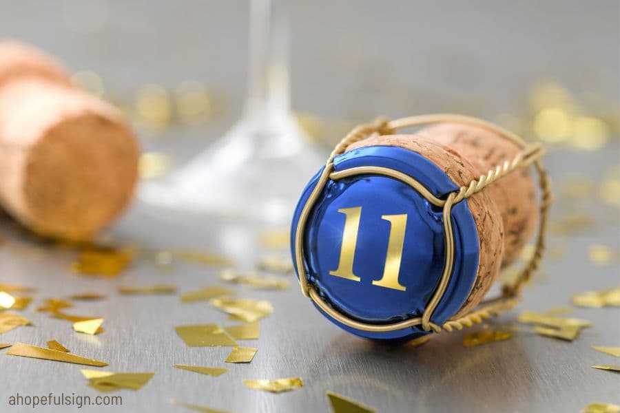 Angel number 11 symbolism: Champagne cap with number 11