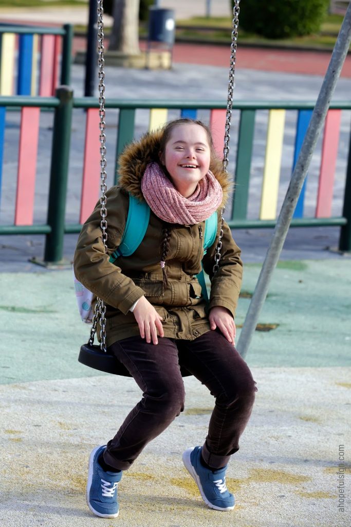 Girl having fun on the swing