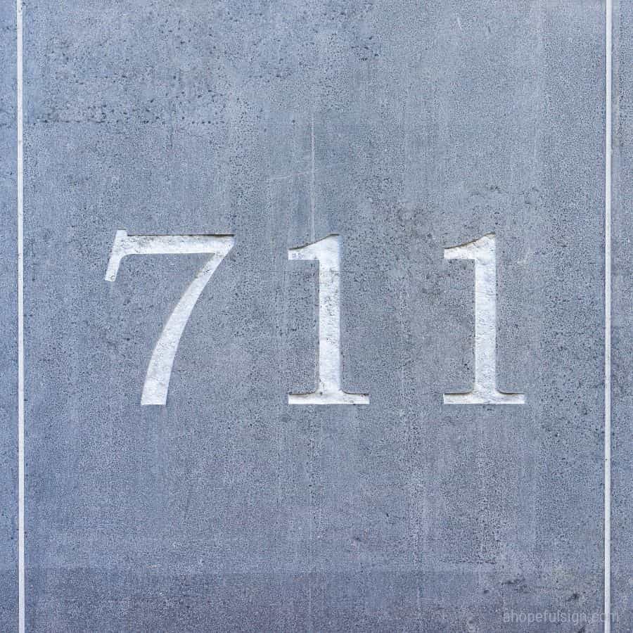 House number seven hundred and eleven, engraved in stone.