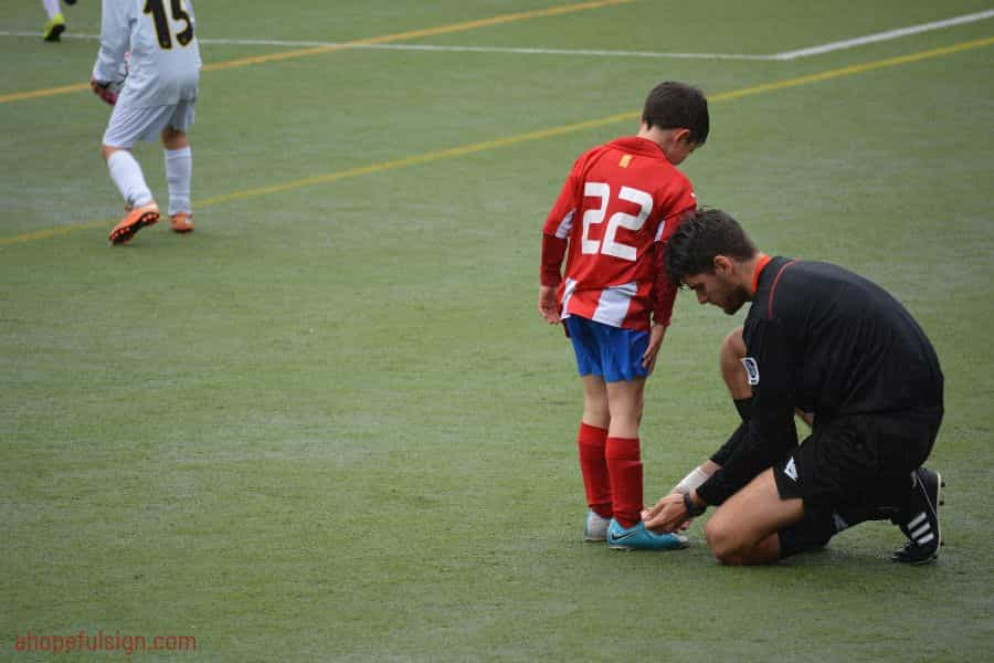 Young footballer with jersey number 22.