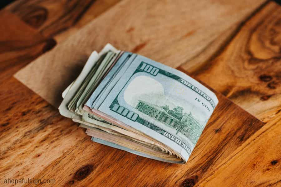 US banknotes on a wooden table