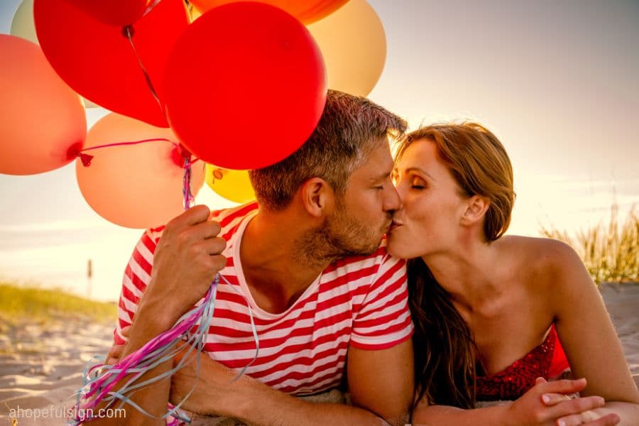 happy balloon relationship lying in sunset daw