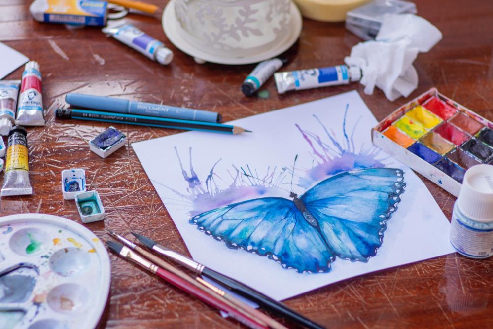 Blue butterfly painted in watercolors
