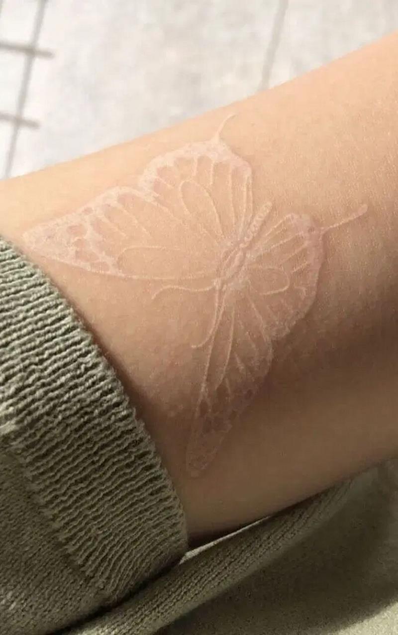 White butterfly tattoo